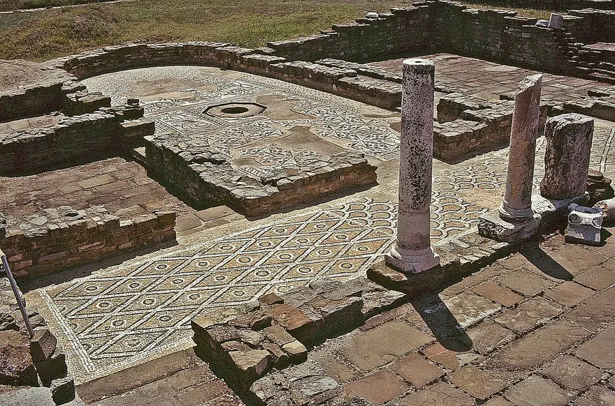 Re-erected columns and a mosaic floor inside one of the excavated basilicas at Stobi