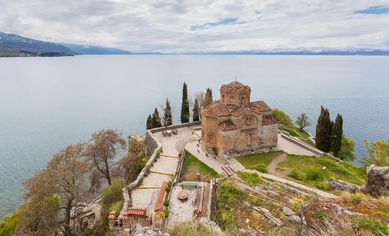Close view of the brick and stone walls and dome of the Church of St. John at Kaneo