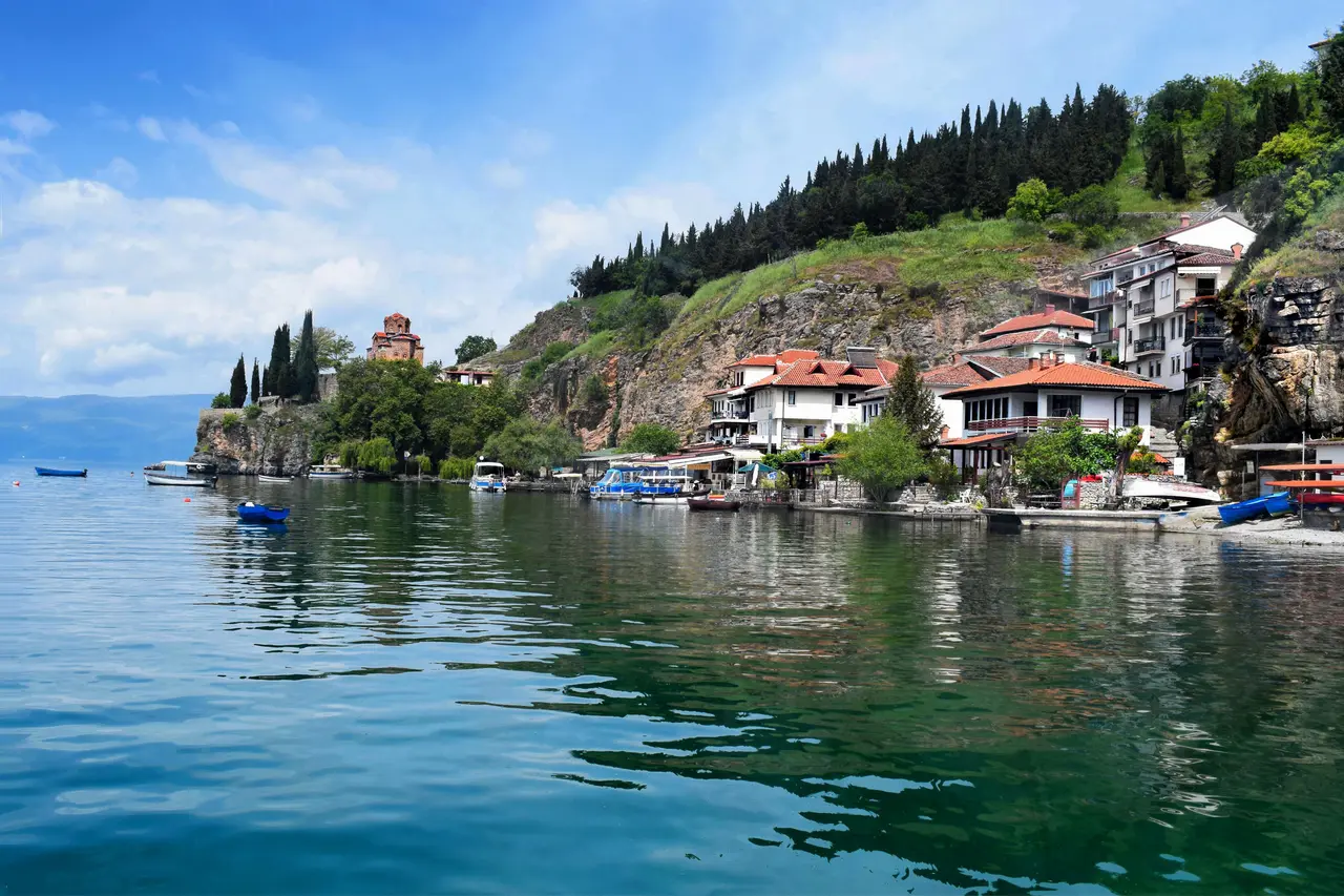 Kaneo Bay below the church, with a pebble beach and fish restaurants on Lake Ohrid