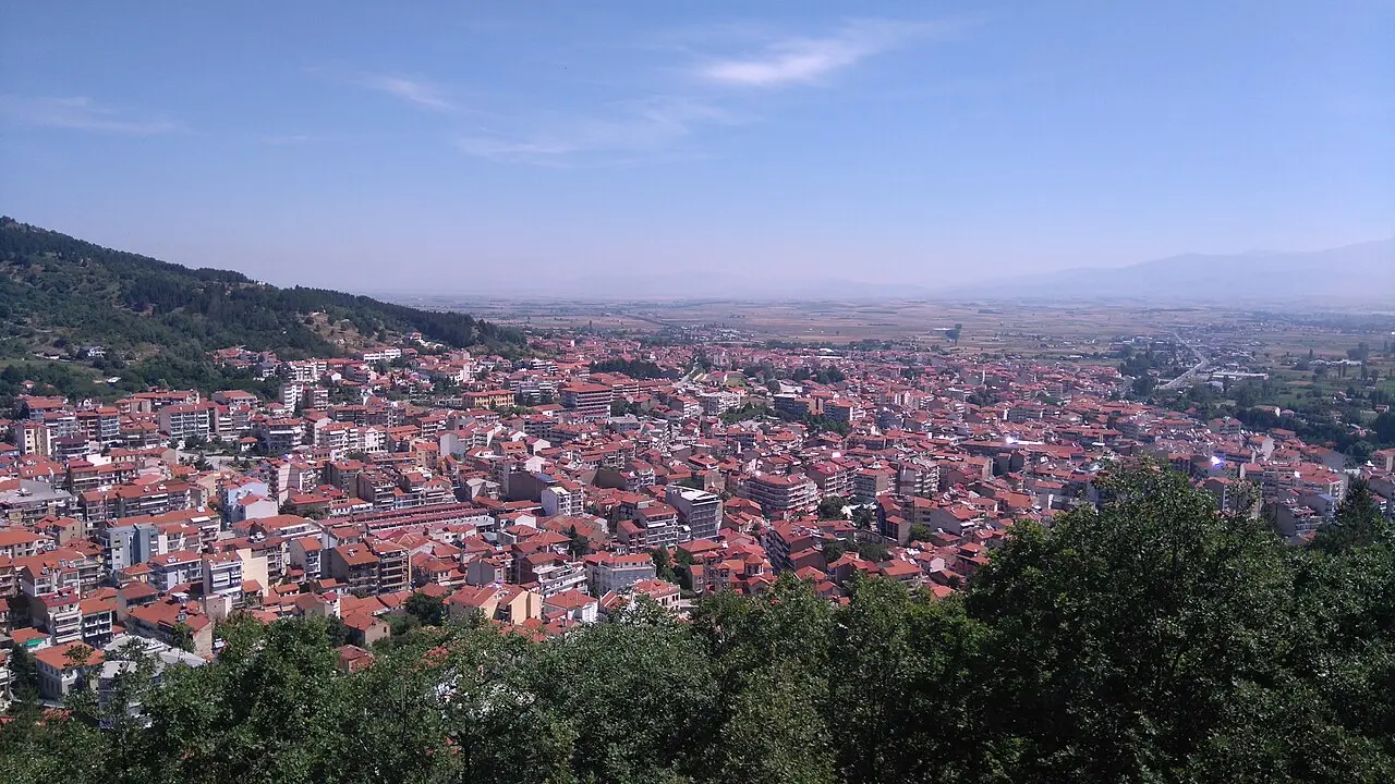 Florina, Greece, seen from above: a town of red-tiled roofs in a valley surrounded by hills