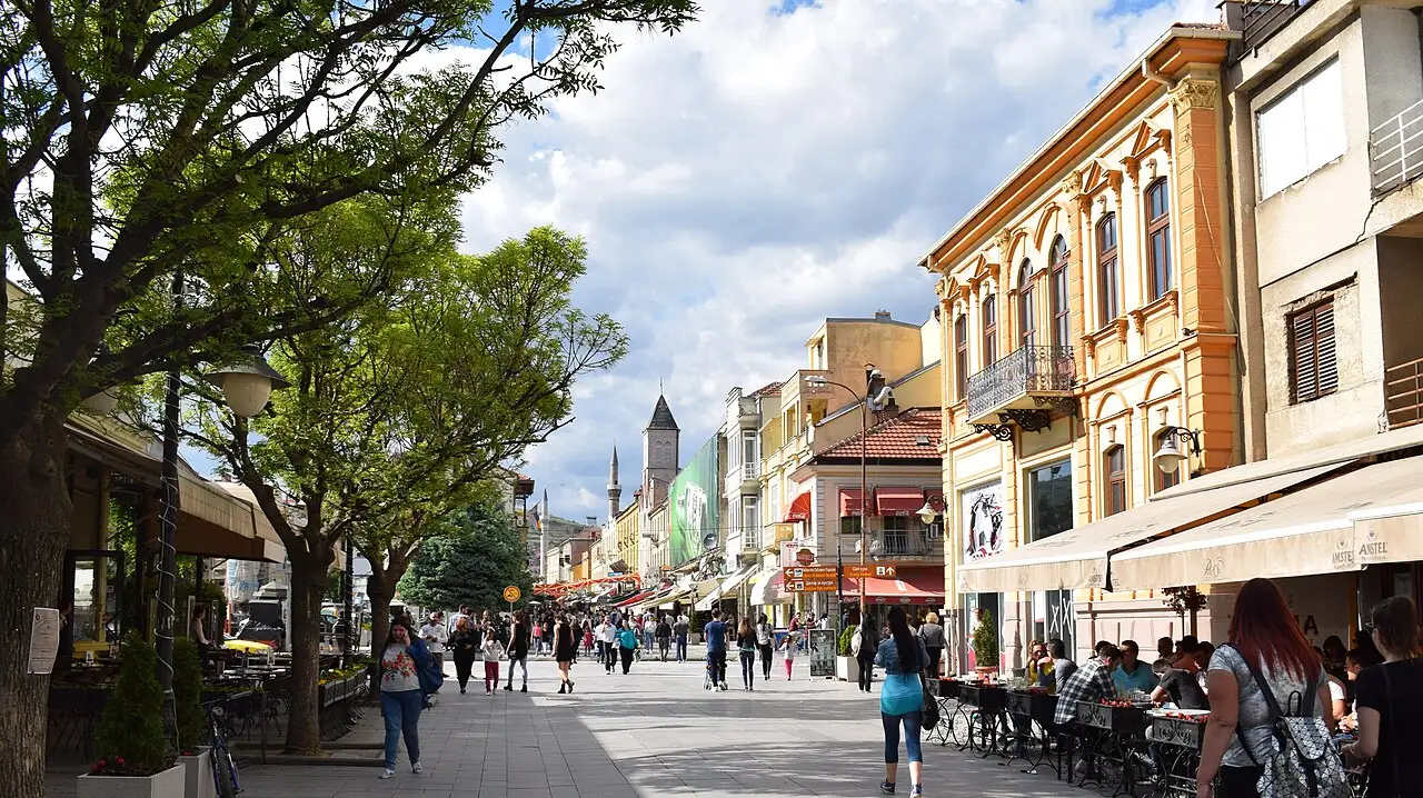 Bitola's Široki Sokak pedestrian street with neoclassical facades and the clock tower in the distance