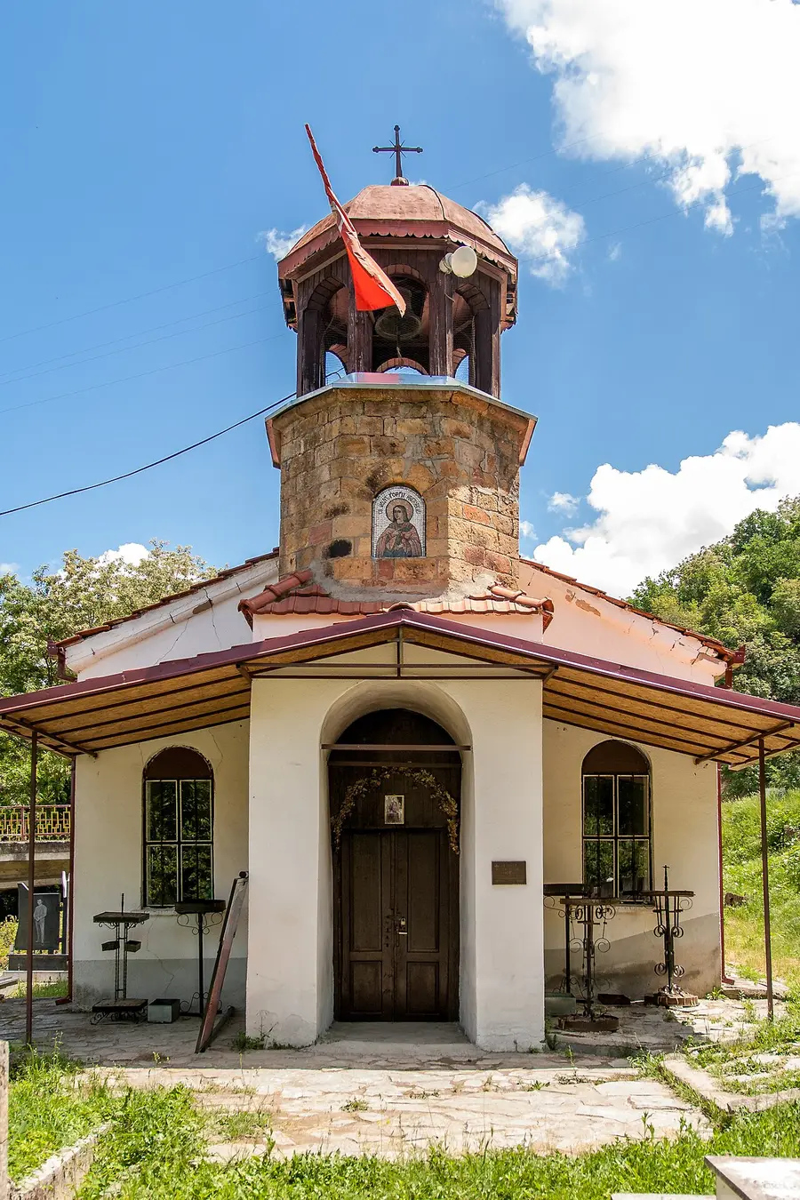 The small stone church of St George of Kratovo with its wooden bell tower and an icon over the porch