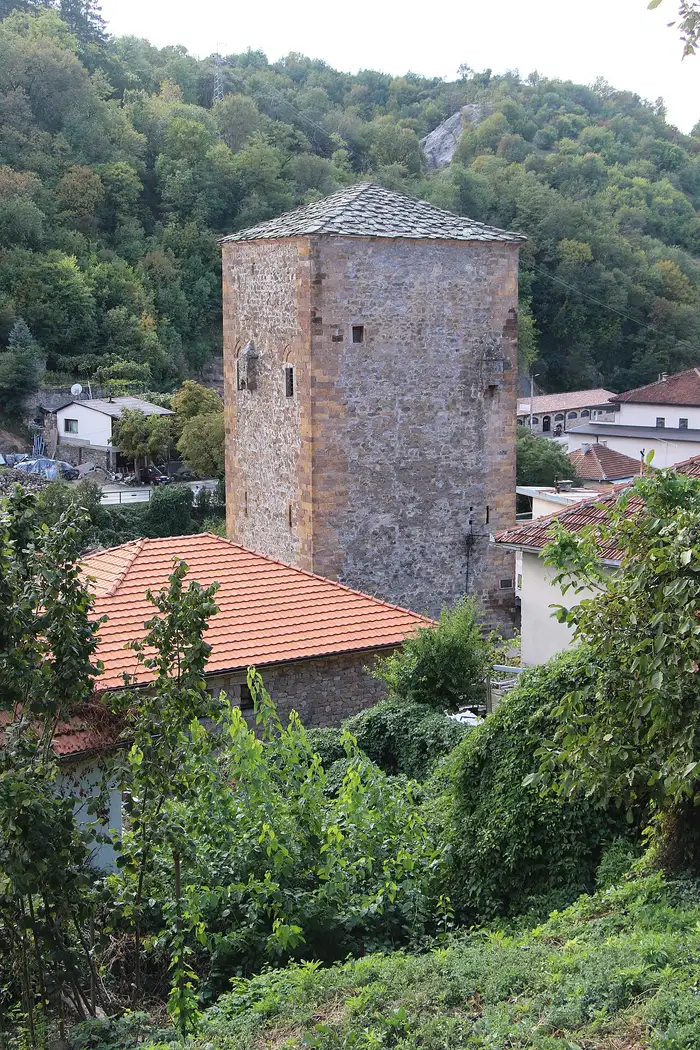 The tall square Simic defense tower in Kratovo with its stone-tiled pyramidal roof