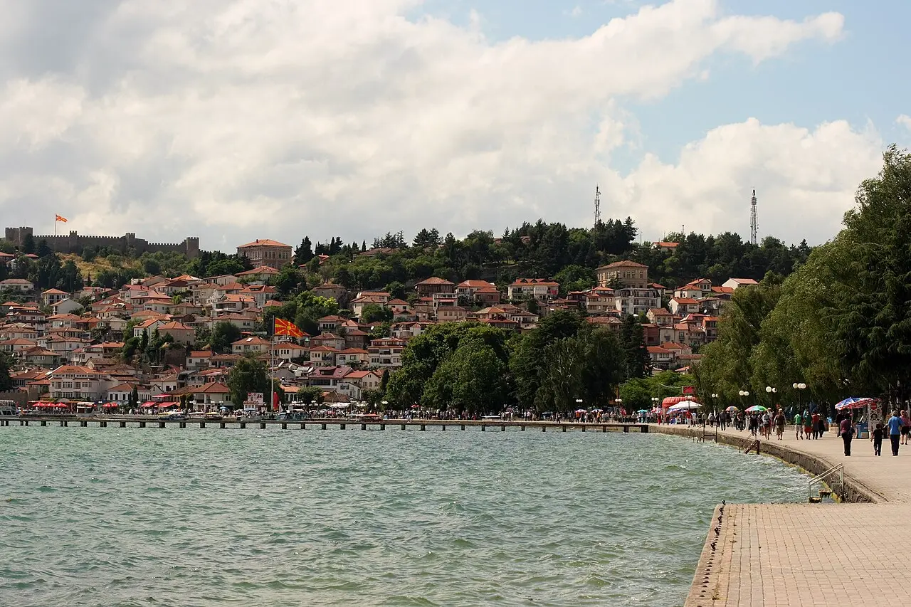 The lakeside promenade in Ohrid with the old town climbing the hill behind