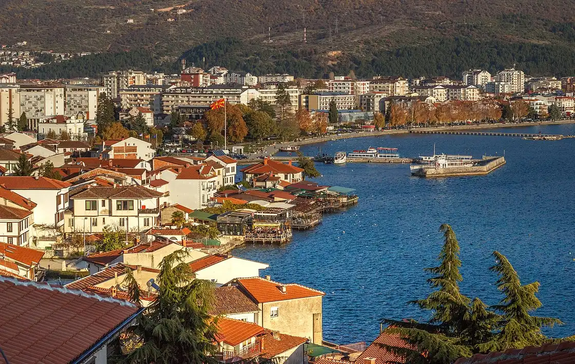 Ohrid old town and Lake Ohrid at golden hour with boats on the water