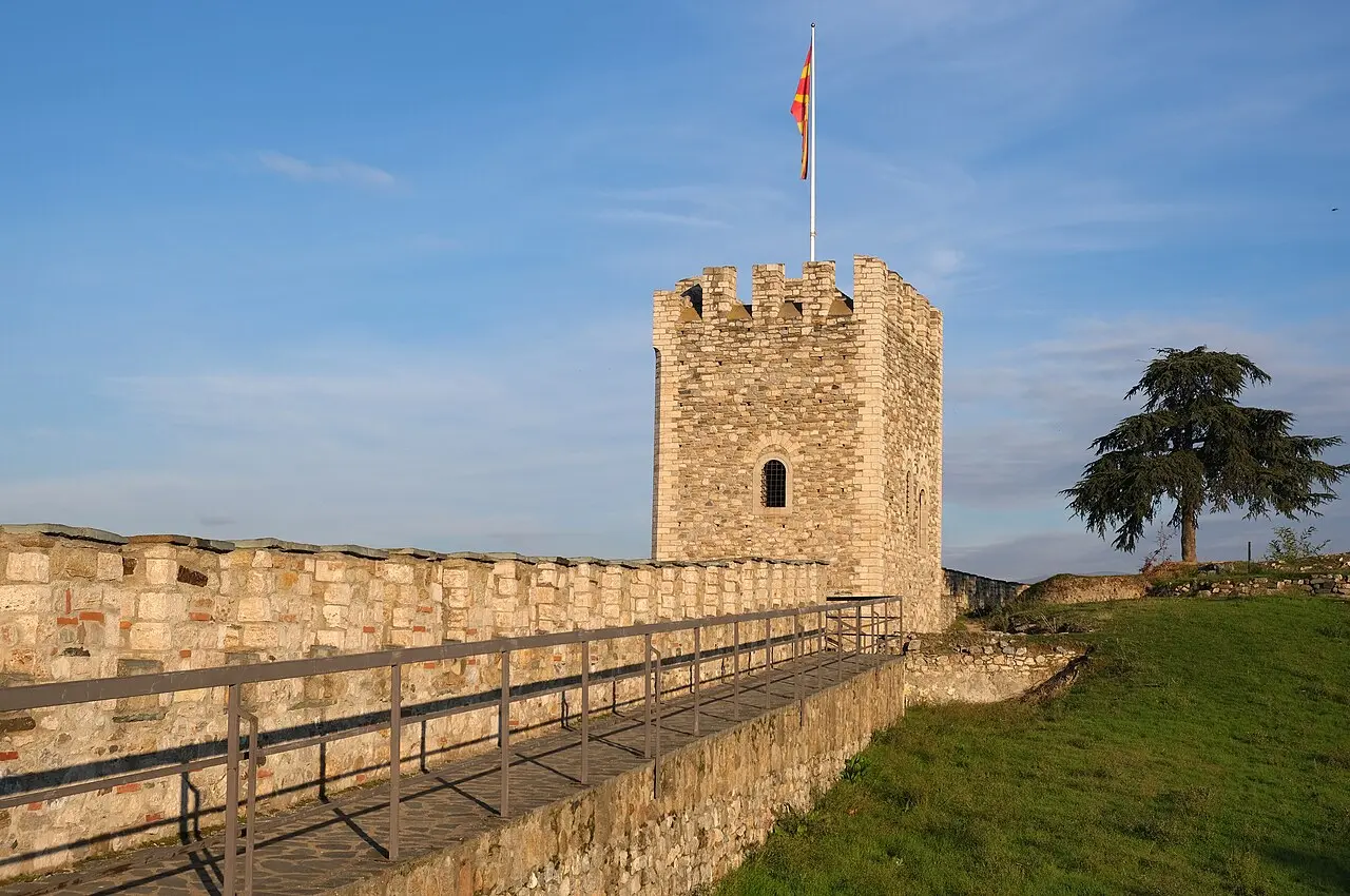 Tower and walls of the Kale Fortress in Skopje flying the North Macedonian flag