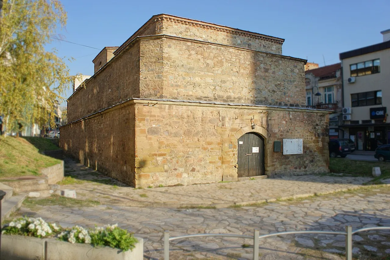 The stone exterior of the Bezisten covered market in Stip, now used as an art gallery, seen from the street