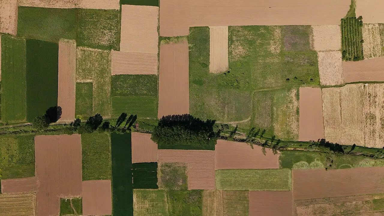 Aerial view of the patchwork fields of the Strumica plain, the fertile valley around the town