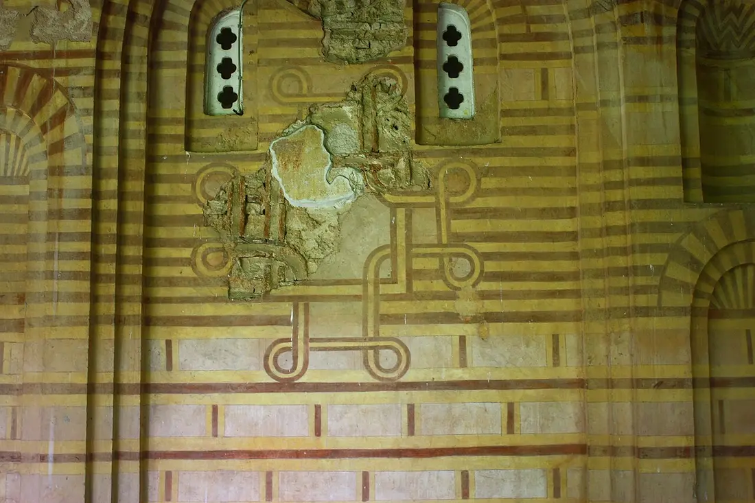 An interlaced painted cross on the interior wall of the Veljusa monastery church