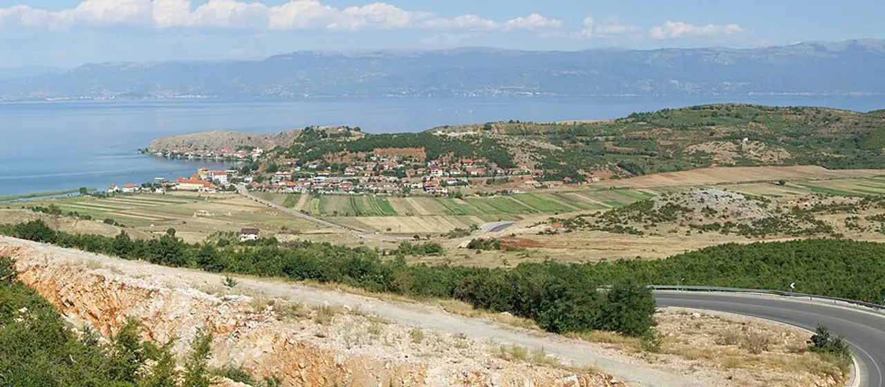 The road descending toward Lin village and Lake Ohrid near the Albania-North Macedonia border