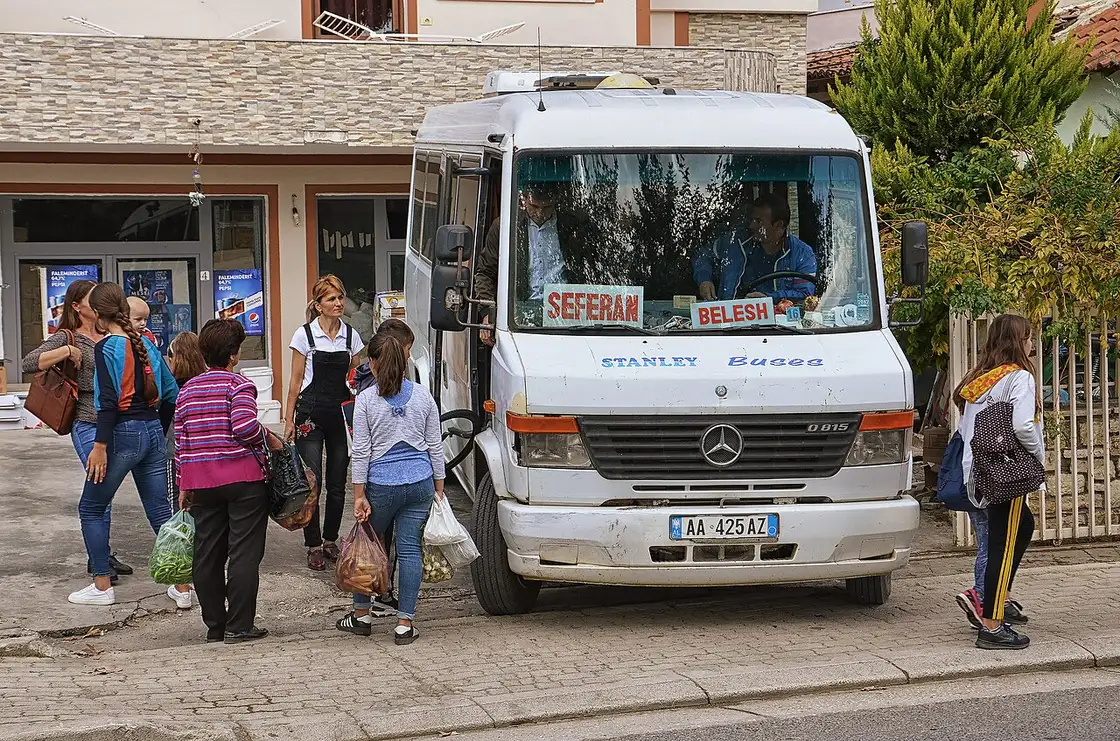 Passengers boarding a shared minibus, a furgon, in Albania