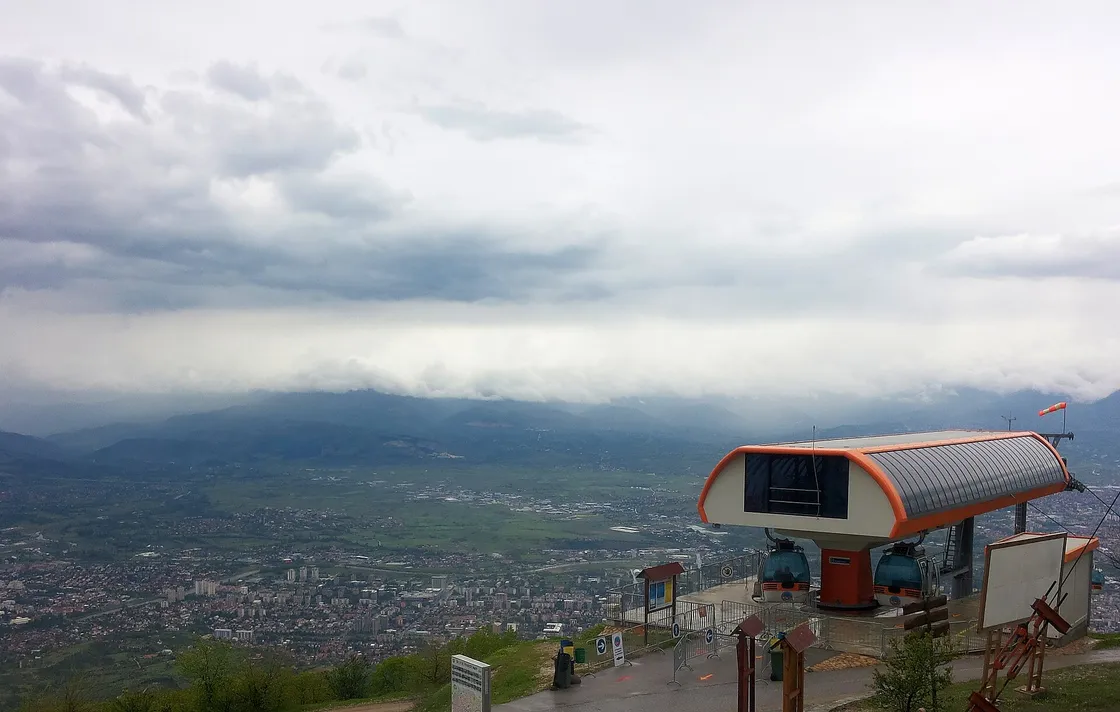 The Vodno cable car and support tower on the wooded slope with the funicular line climbing the ridge