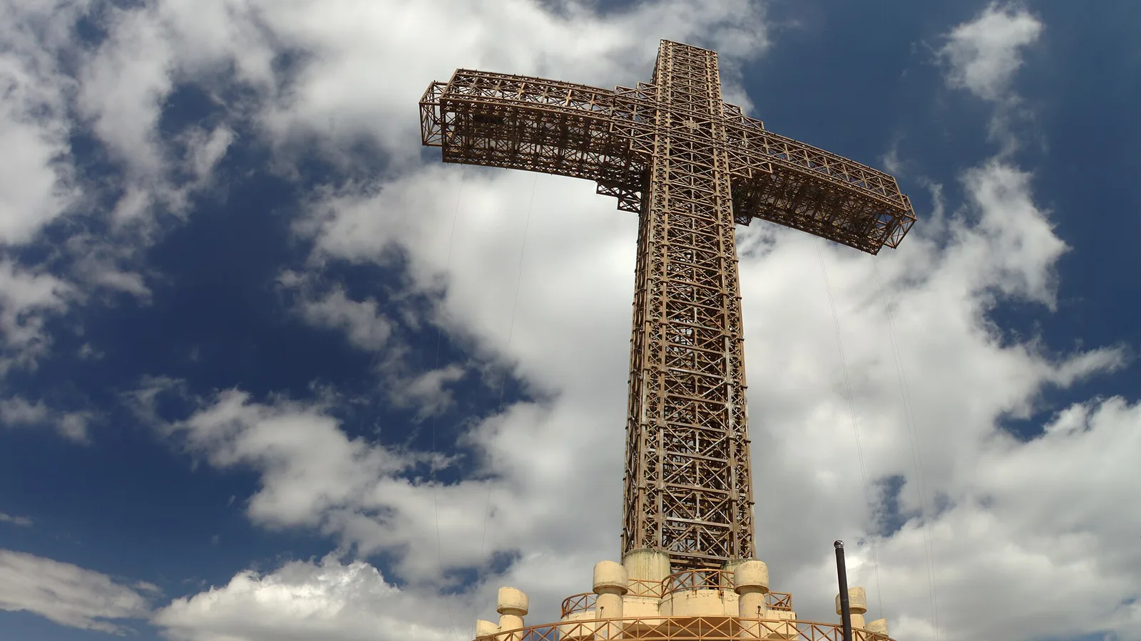 The 66-metre Millennium Cross on the summit of Mount Vodno with visitors on the terrace below it